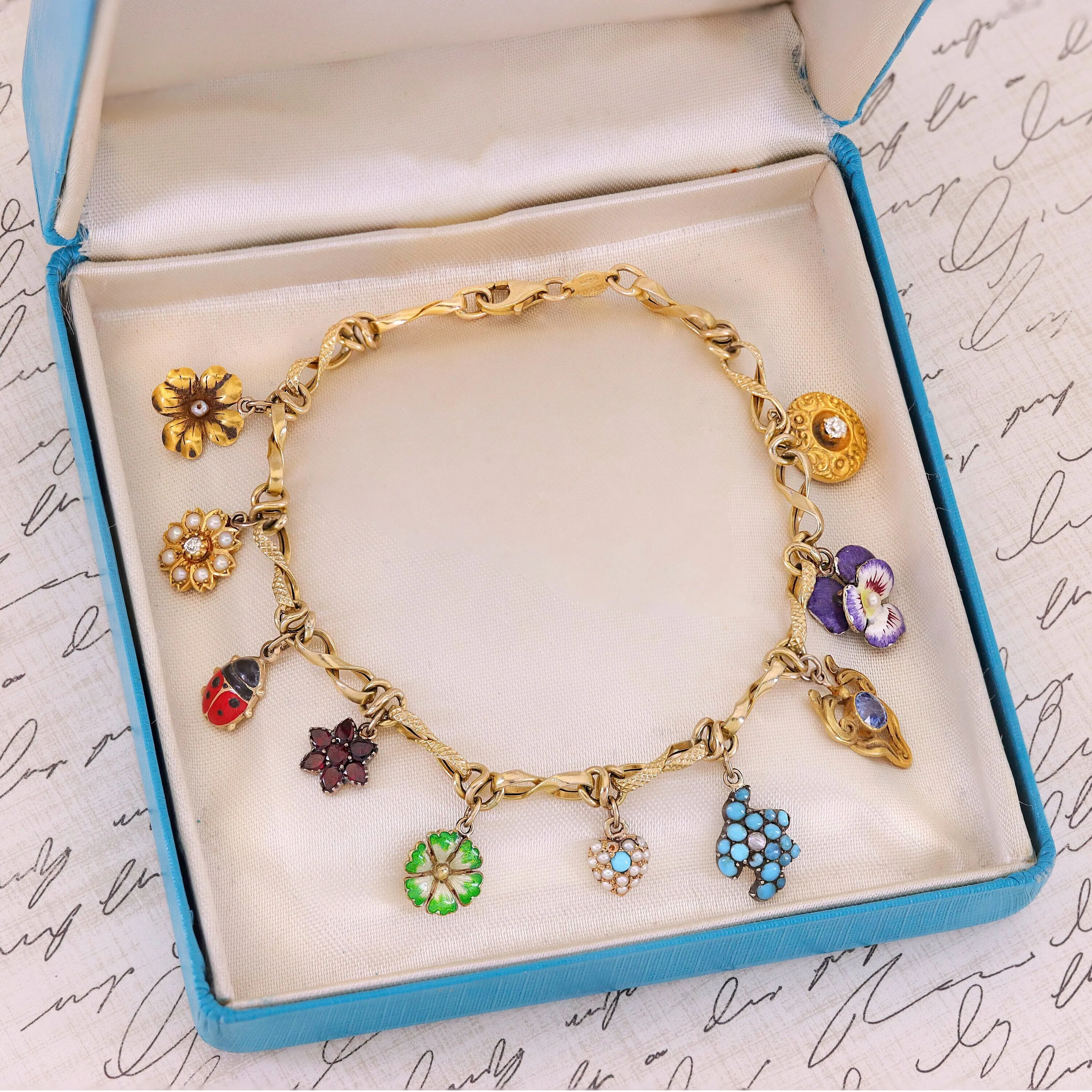 10k Gold Charm Bracelet with 10 Gemstone and Enamel Charms