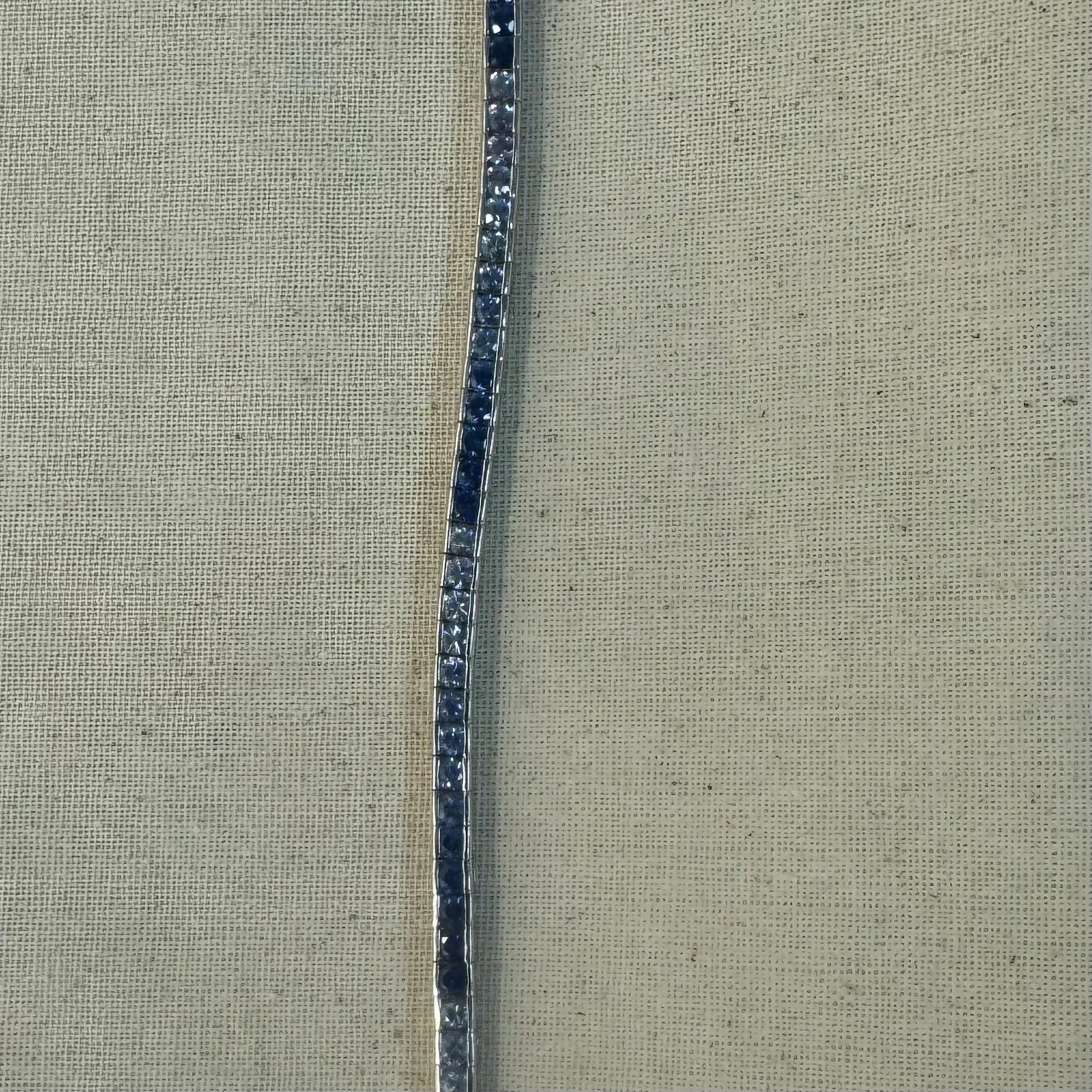 14K gold Tennis Bracelet set with different shades of Sapphire