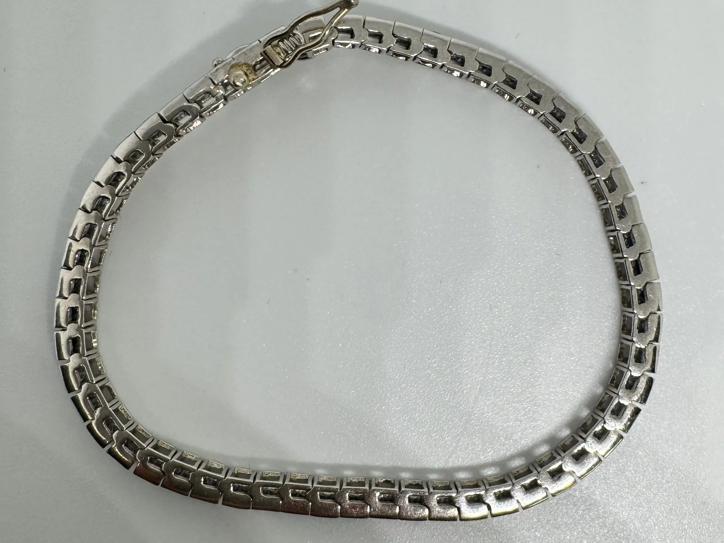 14K gold Tennis Bracelet set with different shades of Sapphire
