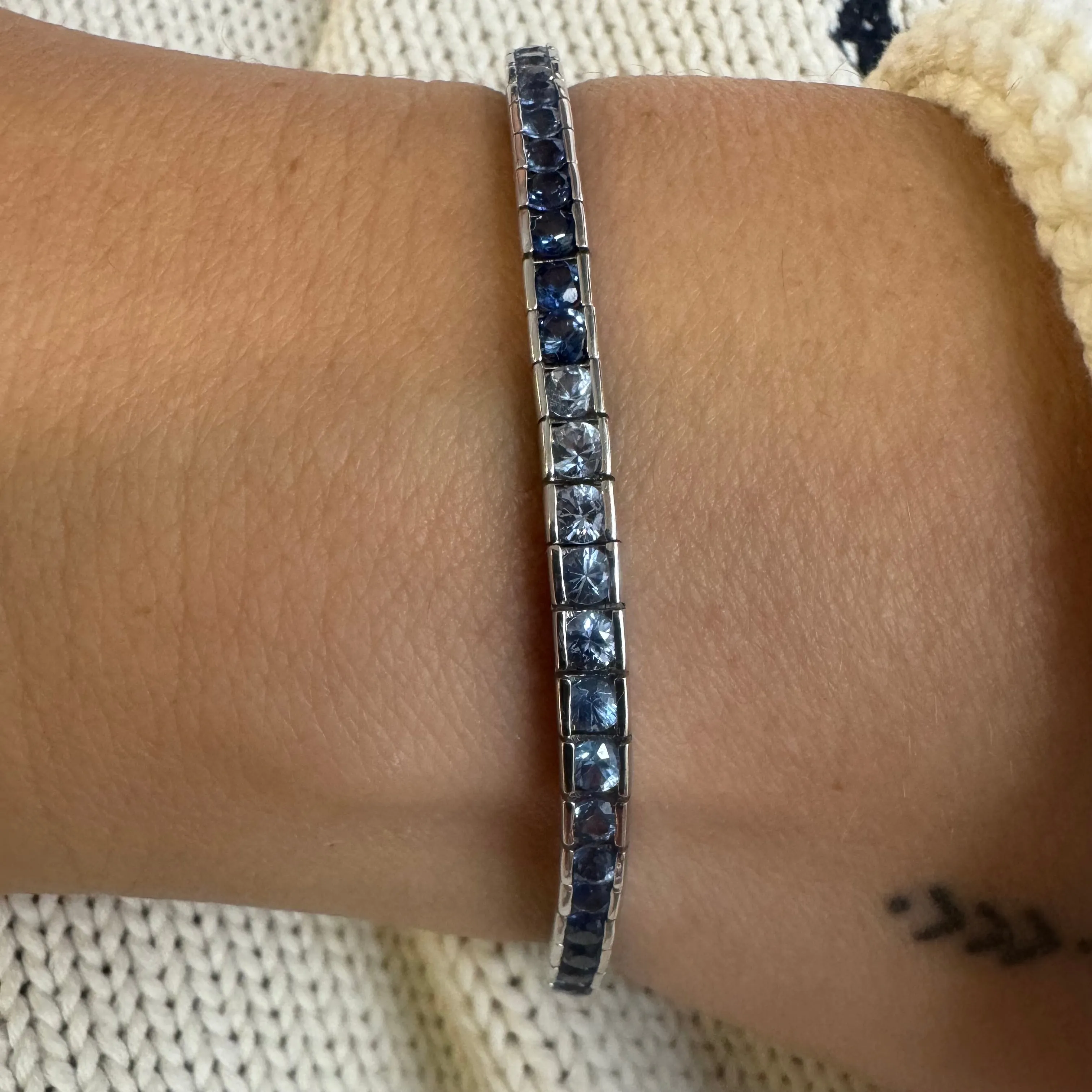 14K gold Tennis Bracelet set with different shades of Sapphire