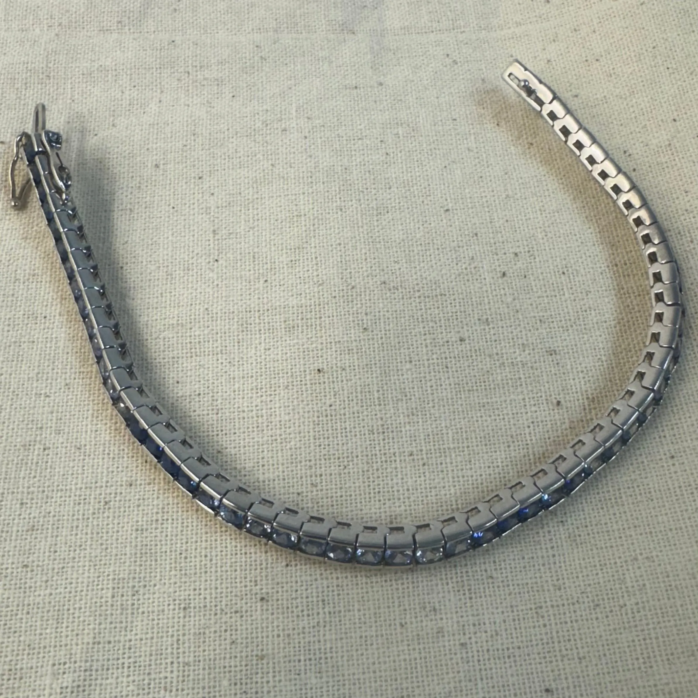 14K gold Tennis Bracelet set with different shades of Sapphire