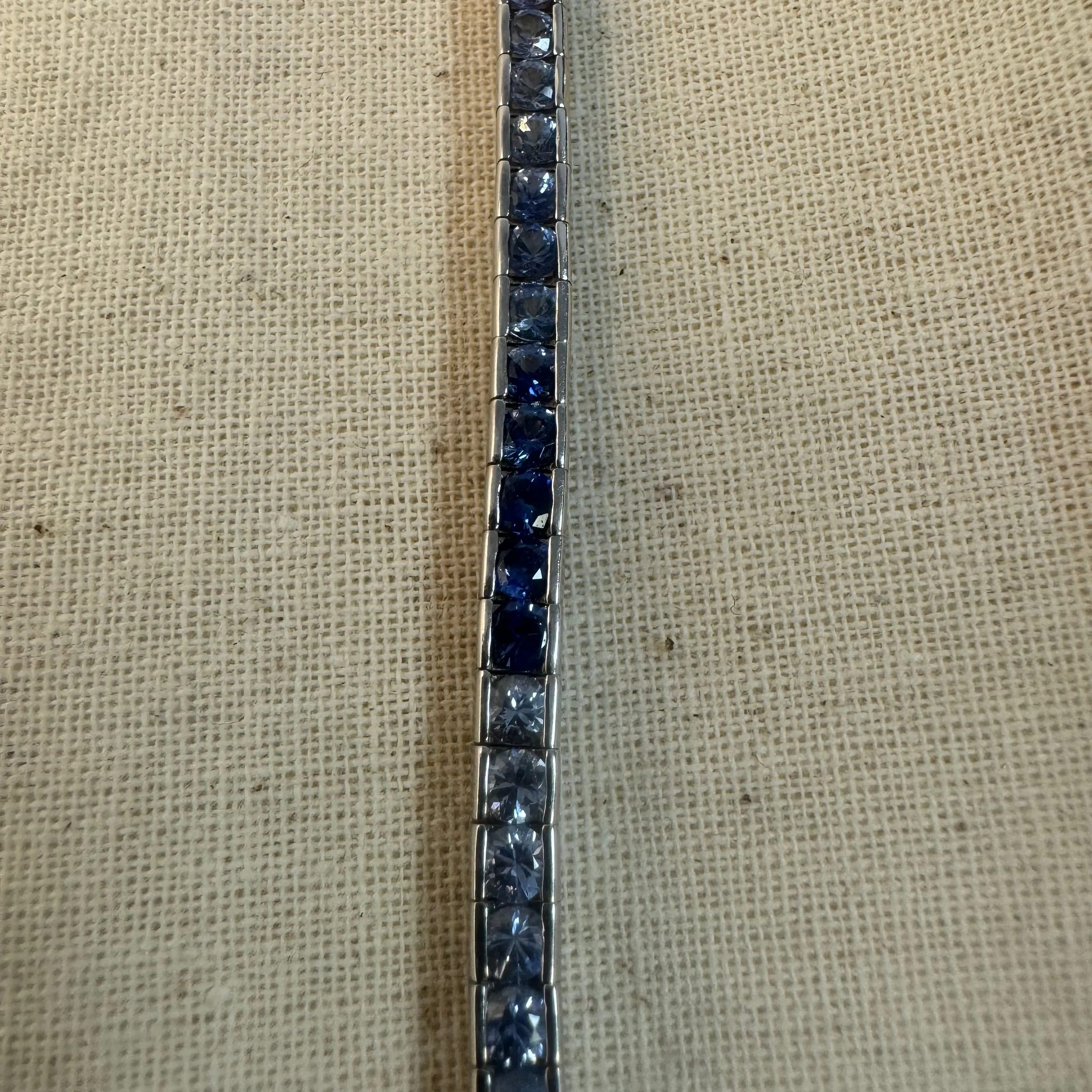 14K gold Tennis Bracelet set with different shades of Sapphire