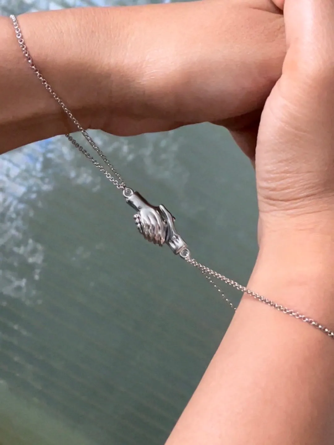 (Set of 2) Silver Plated Hand Holding Magnet Bracelets