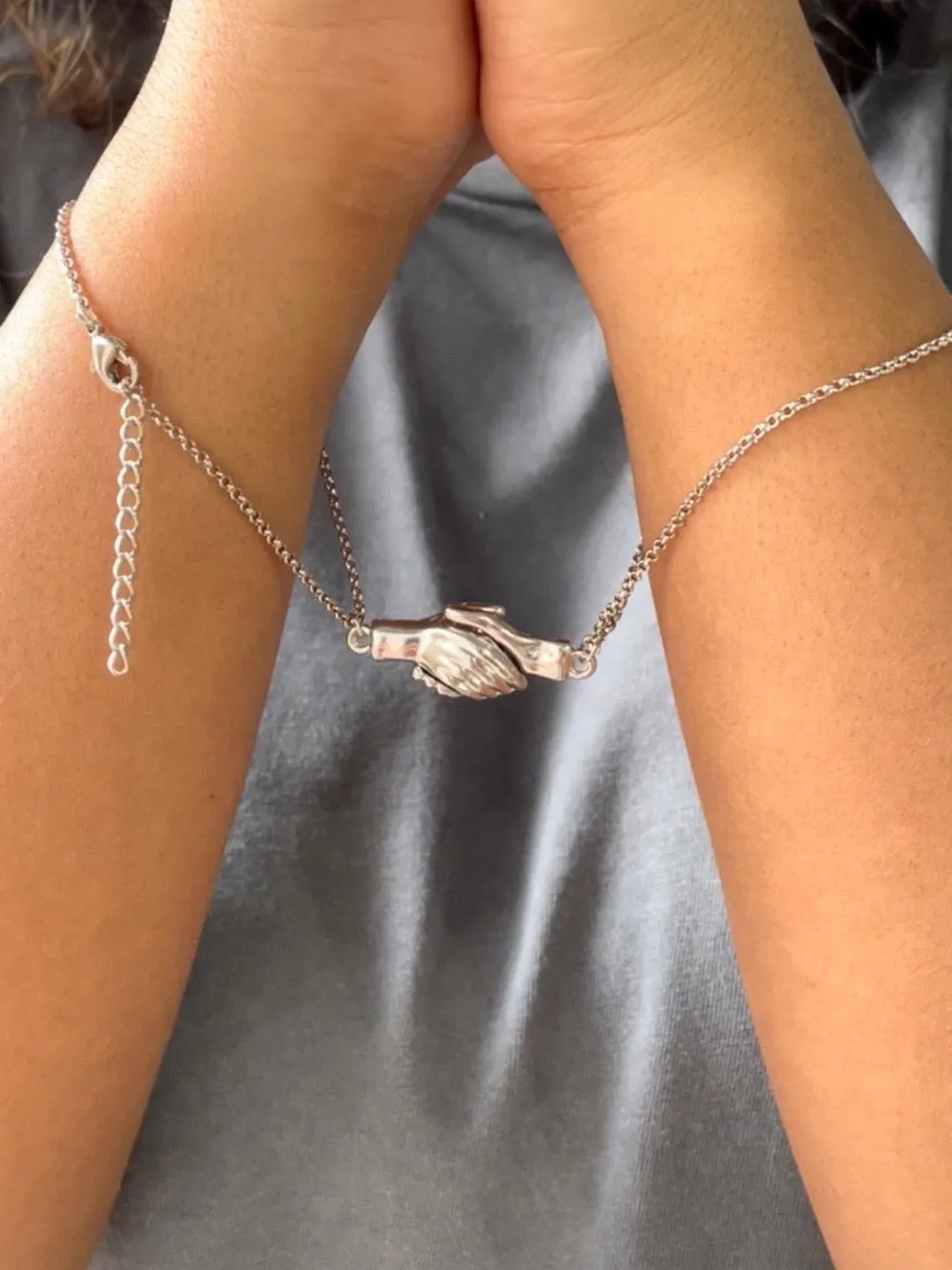 (Set of 2) Silver Plated Hand Holding Magnet Bracelets